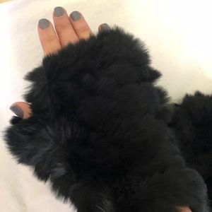 Jocelyn fingerless rabbit fur gloves in black.